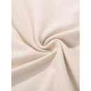 Close-up of soft beige fabric texture showing fine knit weave and smooth surface