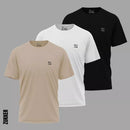 Set of three Zukker crew neck t-shirts in beige white and black with small logo on chest